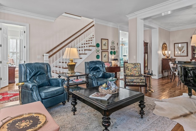 living area with stairway, wood finished floors, and crown molding