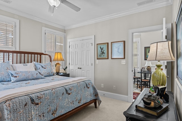 carpeted bedroom featuring visible vents, crown molding, and baseboards