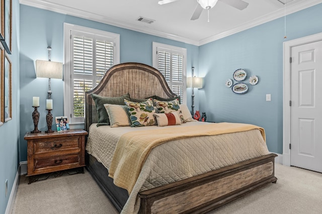 carpeted bedroom featuring attic access, visible vents, ornamental molding, and multiple windows