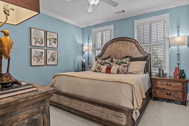 carpeted bedroom featuring multiple windows, visible vents, a ceiling fan, and ornamental molding