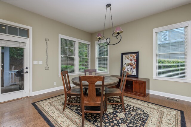 dining area with wood-type flooring