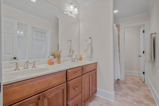 bathroom with crown molding and vanity
