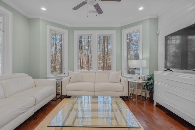 sunroom featuring a wealth of natural light and ceiling fan