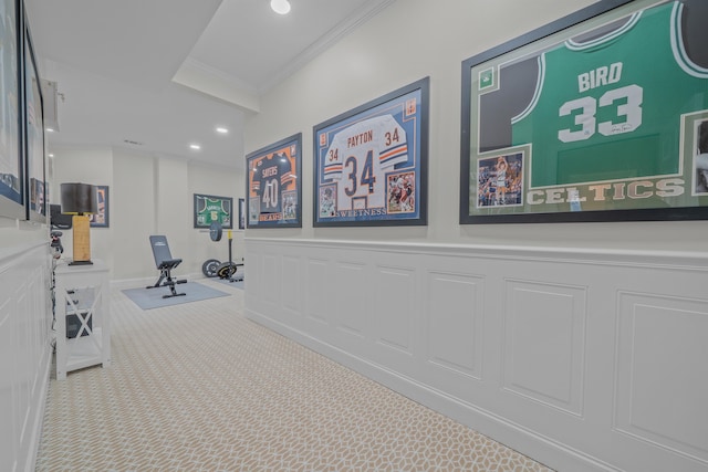 interior space featuring light colored carpet and ornamental molding