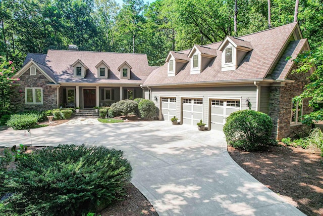 cape cod house featuring a garage