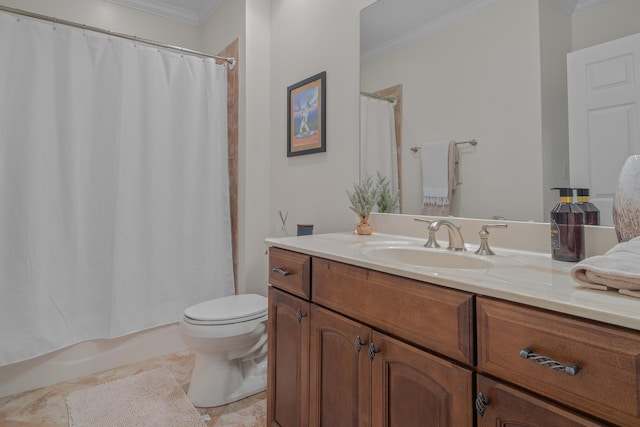 bathroom with vanity, crown molding, and toilet