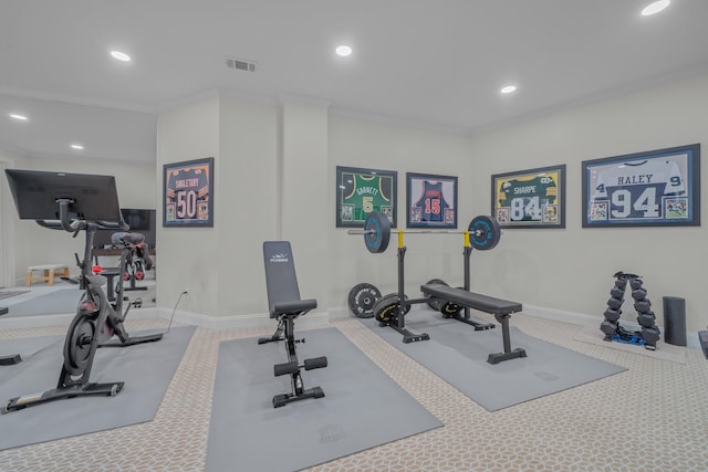 exercise area featuring crown molding and carpet flooring