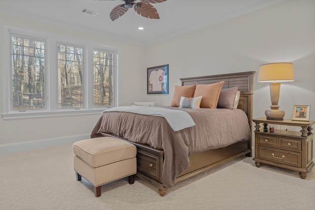 bedroom featuring crown molding, light colored carpet, and ceiling fan