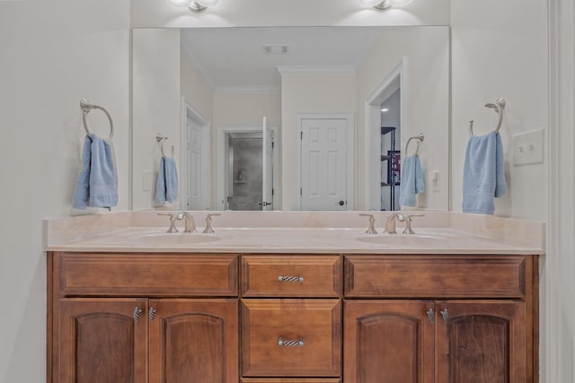 bathroom featuring crown molding and vanity