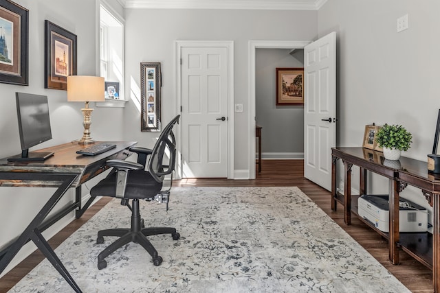 office area with ornamental molding and dark wood-type flooring