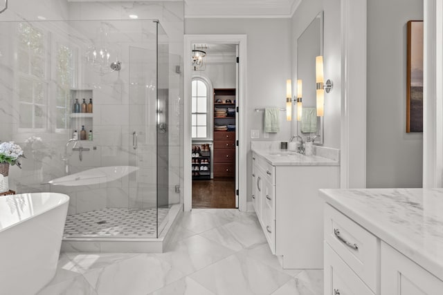 bathroom featuring vanity, crown molding, and independent shower and bath