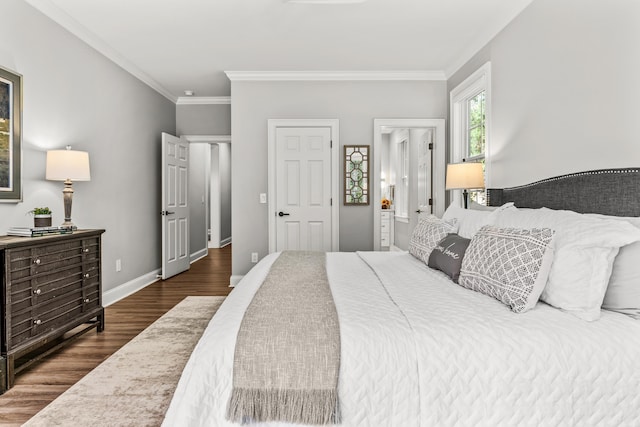 bedroom with ornamental molding, dark hardwood / wood-style floors, and ensuite bathroom