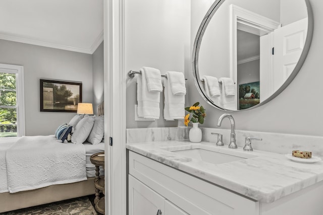 bathroom featuring crown molding and vanity