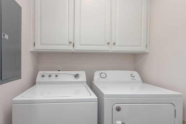 1061B Club House Ln, Greensboro, GA 30642 - clothes washing area featuring cabinet space, electric panel, and washer and dryer