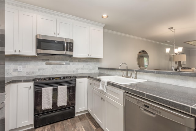 1061B Club House Ln, Greensboro, GA 30642 - kitchen with white cabinetry, a sink, dark countertops, and appliances with stainless steel finishes