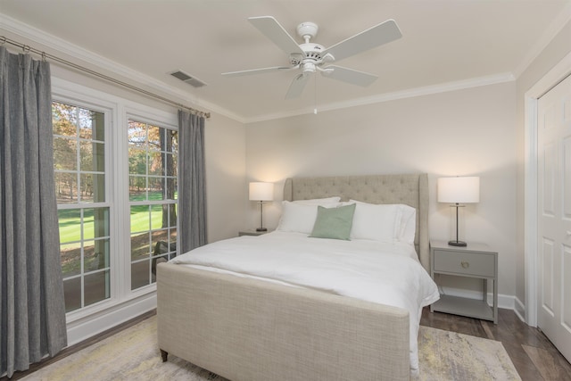 1061B Club House Ln, Greensboro, GA 30642 - bedroom featuring crown molding, a ceiling fan, wood finished floors, baseboards, and visible vents