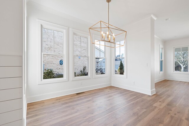 1358 Veranda Park Dr, Madison, GA 30650 - unfurnished dining area featuring baseboards, a chandelier, visible vents, and light wood-style floors