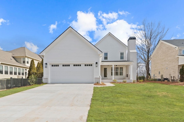 1358 Veranda Park Dr, Madison, GA 30650 - traditional-style house with a chimney, an attached garage, fence, driveway, and a front lawn