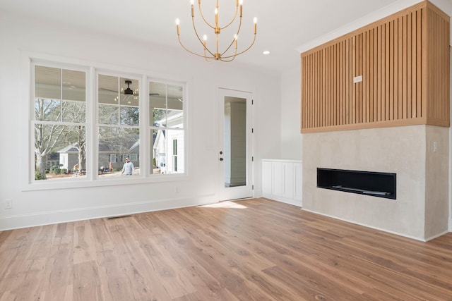 1358 Veranda Park Dr, Madison, GA 30650 - unfurnished living room with recessed lighting, a fireplace, wood finished floors, visible vents, and baseboards
