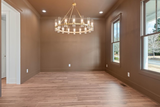 1358 Veranda Park Dr, Madison, GA 30650 - unfurnished room featuring light wood-type flooring, an inviting chandelier, baseboards, and ornamental molding