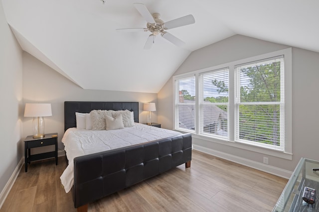 1010F Tailwater, Greensboro, GA 30642 - bedroom with baseboards, a ceiling fan, wood finished floors, and lofted ceiling