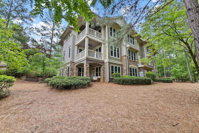 1010F Tailwater, Greensboro, GA 30642 - exterior space featuring stone siding and a balcony