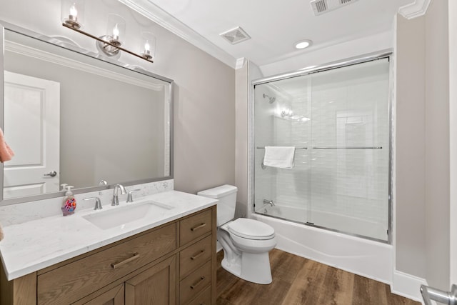 1010F Tailwater, Greensboro, GA 30642 - full bathroom featuring crown molding, vanity, toilet, wood finished floors, and visible vents