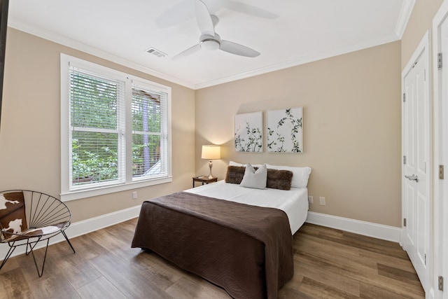 1010F Tailwater, Greensboro, GA 30642 - bedroom featuring crown molding, visible vents, and wood finished floors