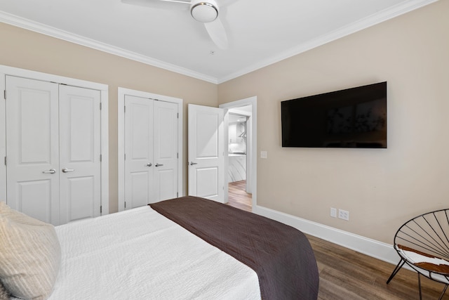 1010F Tailwater, Greensboro, GA 30642 - bedroom with crown molding, ceiling fan, two closets, baseboards, and wood finished floors