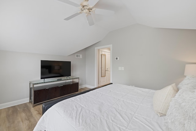 1010F Tailwater, Greensboro, GA 30642 - bedroom with baseboards, visible vents, wood finished floors, and lofted ceiling