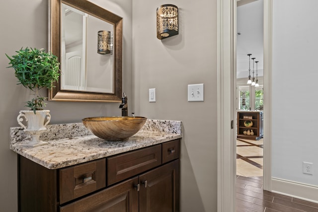 bathroom with vanity and wood-type flooring