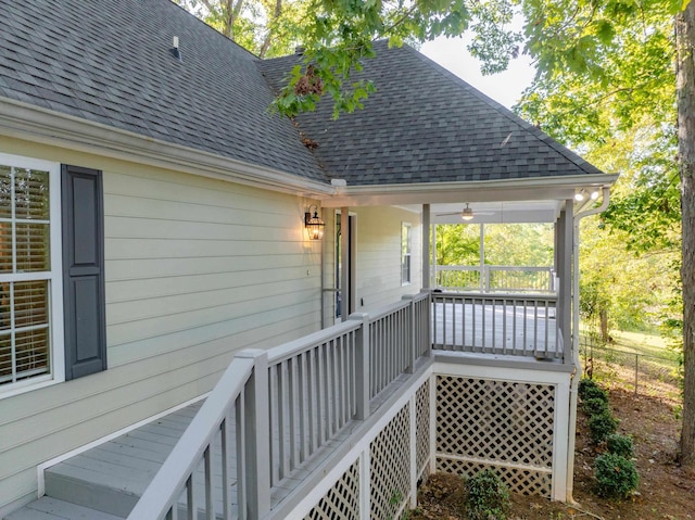 wooden terrace with ceiling fan and a porch