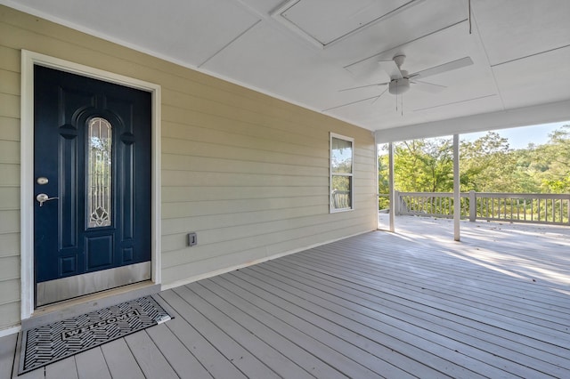 deck with ceiling fan and a porch