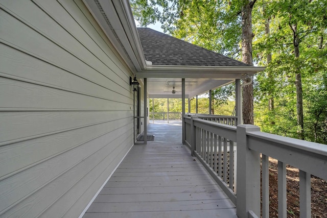 wooden deck featuring ceiling fan