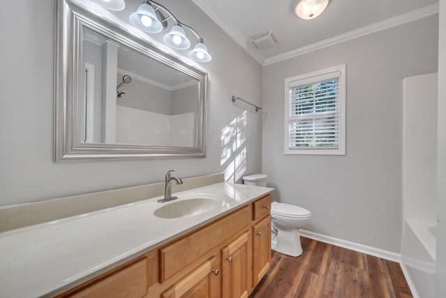 full bathroom featuring wood-type flooring, shower / bath combination, ornamental molding, vanity, and toilet