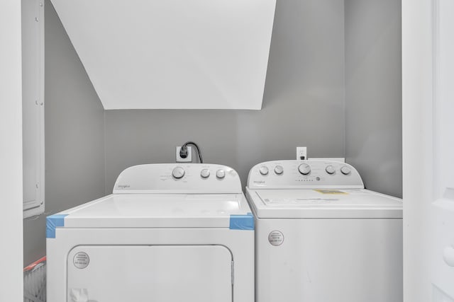 laundry room with washing machine and clothes dryer