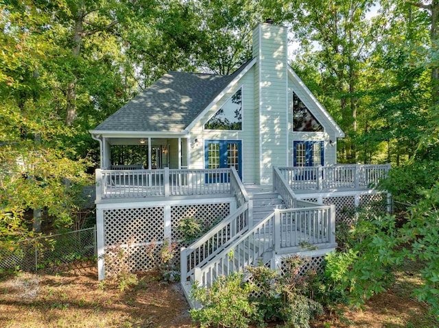 rear view of house featuring covered porch