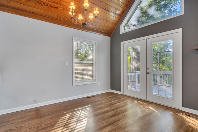 interior space featuring wood ceiling, hardwood / wood-style flooring, vaulted ceiling, french doors, and a chandelier