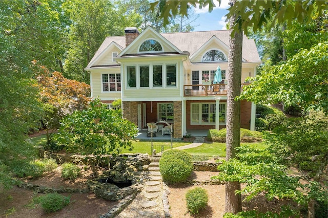 rear view of property featuring a patio area