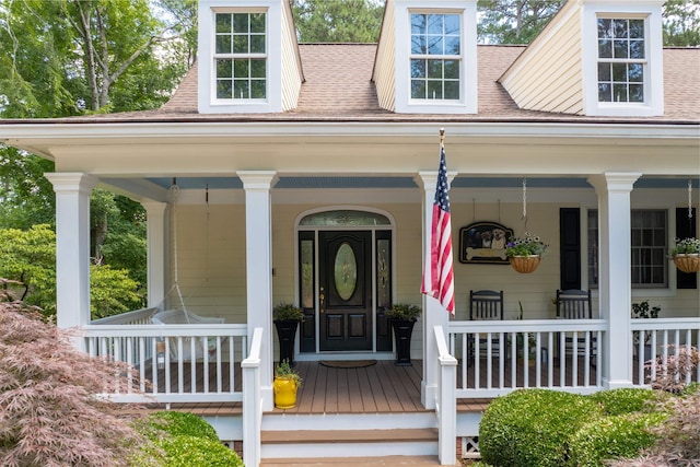 property entrance with covered porch