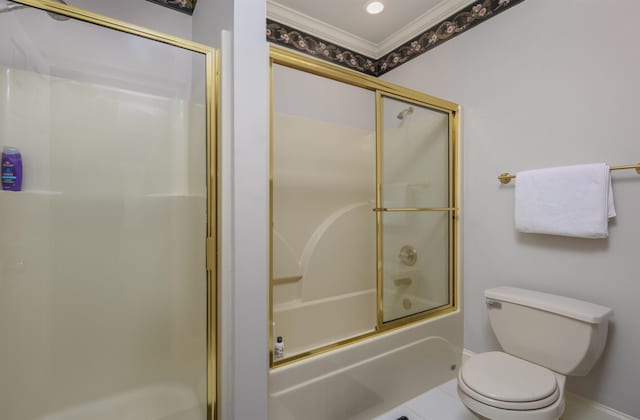 bathroom with ornamental molding, combined bath / shower with glass door, tile patterned floors, and toilet