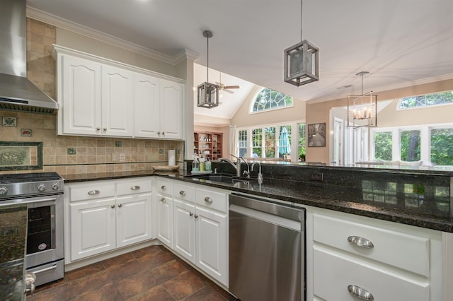 kitchen featuring sink, appliances with stainless steel finishes, hanging light fixtures, white cabinets, and wall chimney exhaust hood