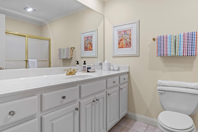 full bath featuring vanity, baseboards, ornamental molding, tile patterned flooring, and toilet