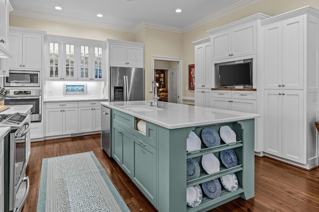 kitchen with a sink, open shelves, white cabinets, and stainless steel appliances