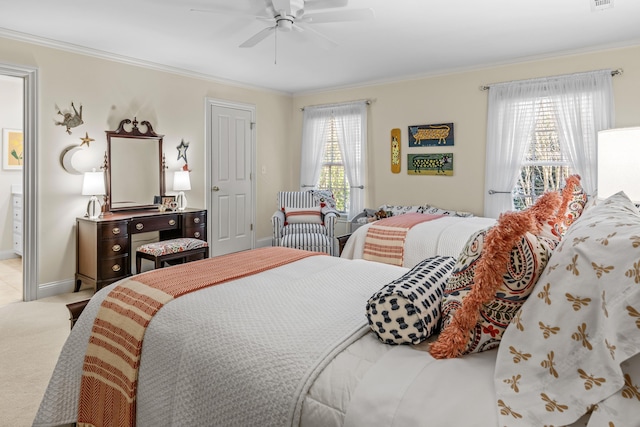 bedroom featuring crown molding, ceiling fan, visible vents, carpet floors, and baseboards