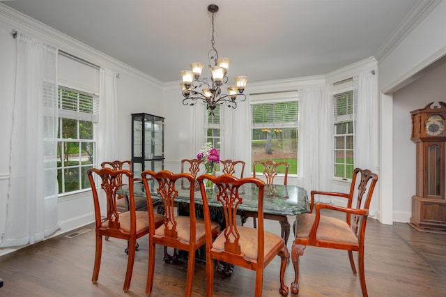 1020 Tallesse Trl, Greensboro, GA 30642 - dining room with a chandelier, ornamental molding, dark wood-type flooring, and baseboards