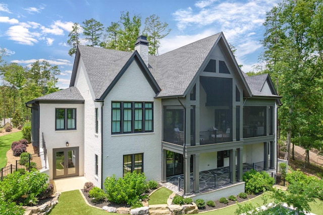 1100 Neary Rdg, Greensboro, GA 30642 - back of property featuring a chimney, a shingled roof, a patio area, french doors, and a sunroom