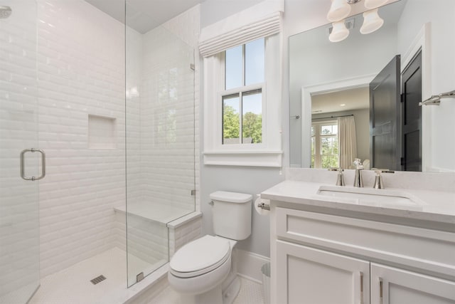 1100 Neary Rdg, Greensboro, GA 30642 - full bath with toilet, a stall shower, vanity, baseboards, and tile patterned flooring