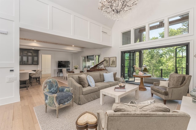 1100 Neary Rdg, Greensboro, GA 30642 - living room with recessed lighting, a high ceiling, a chandelier, and light wood-style flooring
