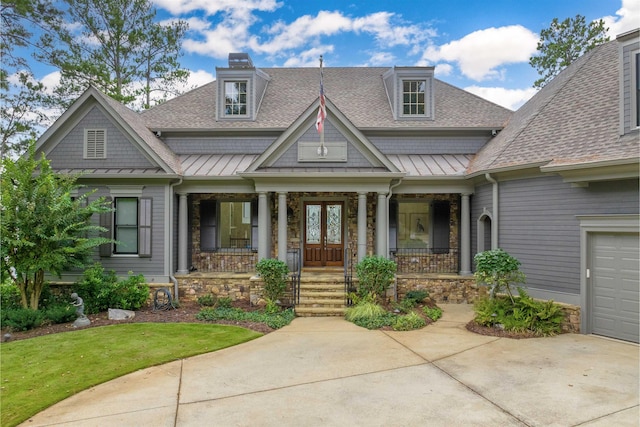 1191 Cory Cir, Greensboro, GA 30642 - craftsman-style home featuring a porch, a shingled roof, a standing seam roof, driveway, and stone siding